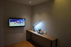 TV a/nebo společenská místnost v ubytování Super 8 Hotel @ Bayan Baru