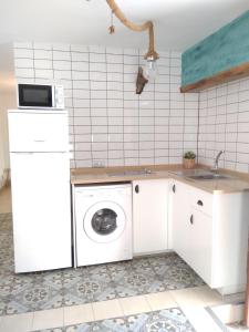 Kuchyň nebo kuchyňský kout v ubytování Conil Homes III Apartments