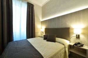 Кровать или кровати в номере Hotel Lamberti