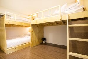 Ein Bett oder Betten in einem Zimmer der Unterkunft Step Inn Myeongdong 1