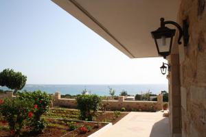 a view of the ocean from a house at Romantica Apartments in Falasarna