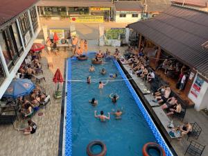 a group of people in a swimming pool at Nana Backpackers Hostel in Vang Vieng