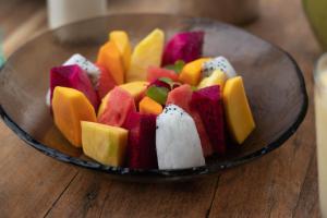 a glass bowl filled with different types of fruit at Song Saa Private Island in Song Saa Private Island