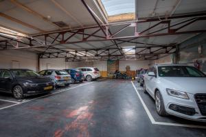 a parking lot with several cars parked in it at Hotel Carlton in Ghent