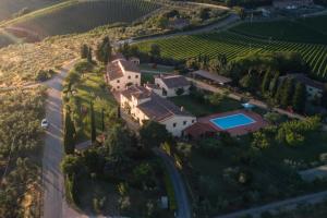 an aerial view of a house in a vineyard at Il Torriano in Montefiridolfi