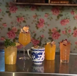a group of drinks sitting on a table at Hôtel Le G (ex Le Genève) in Nice