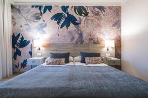 Postel nebo postele na pokoji v ubytování Salles Hotel Málaga Centro