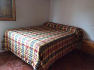 A bed or beds in a room at Cabañas Buenache