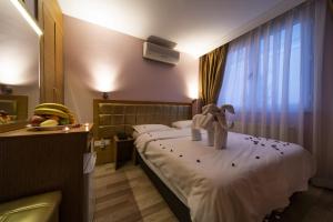 Postel nebo postele na pokoji v ubytování Gulhane Corner Hotel + 37 fotografií