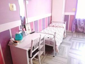Postel nebo postele na pokoji v ubytování Hotel Serenella
