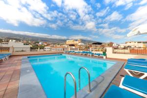 a swimming pool on the roof of a building at Be Smart Florida Plaza in Puerto de la Cruz