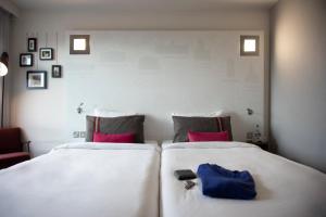 Säng eller sängar i ett rum på pentahotel Inverness