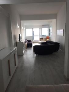 a large living room with a couch and a tv at Oro Apartments in Petrovac na Moru +43 photos