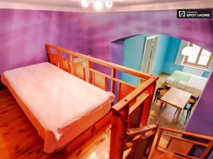 a room with two bunk beds and a dining room at Market Square Apartment II. in Budapest