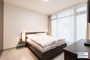 Tempat tidur dalam kamar di Gabriel´s Apartments