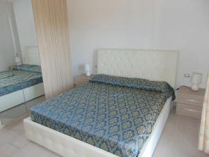 Ένα ή περισσότερα κρεβάτια σε δωμάτιο στο Villetta La Caletta