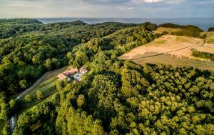 an aerial view of a countryside with trees and a road at The Lodge in Borre