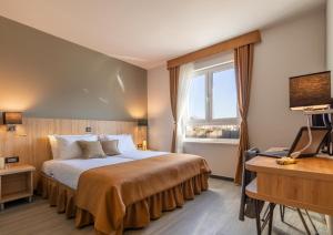 Posteľ alebo postele v izbe v ubytovaní Hotel Resurs