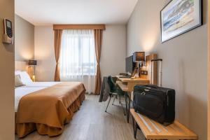 Posteľ alebo postele v izbe v ubytovaní Hotel Resurs