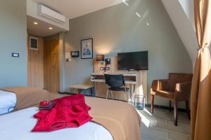 Posteľ alebo postele v izbe v ubytovaní Hotel Resurs