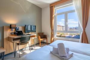 Posteľ alebo postele v izbe v ubytovaní Hotel Resurs