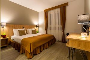 Posteľ alebo postele v izbe v ubytovaní Hotel Resurs
