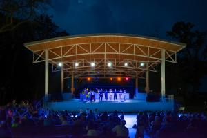 a group of people on a stage at night at Hotel Forest Beach in Primorsko