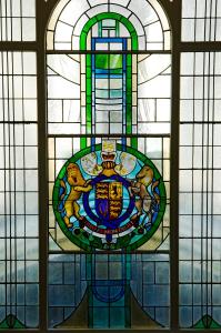 a stained glass window with a crest on it at Royal Victoria Hotel in Hastings