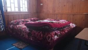 Postel nebo postele na pokoji v ubytování Vamoose Sinkawli Homestay