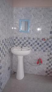 Koupelna v ubytování Vamoose Sinkawli Homestay