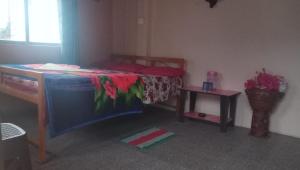 Postel nebo postele na pokoji v ubytování Vamoose Sinkawli Homestay
