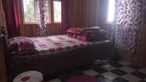 Postel nebo postele na pokoji v ubytování Vamoose Sinkawli Homestay