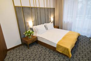 Posteľ alebo postele v izbe v ubytovaní Platinum Residence Boutique