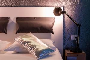 Postel nebo postele na pokoji v ubytování Design B&B Bacvice Arti