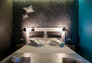 Postel nebo postele na pokoji v ubytování Design B&B Bacvice Arti