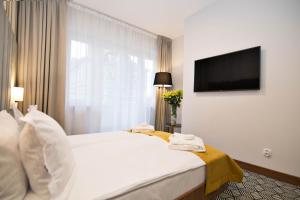 Posteľ alebo postele v izbe v ubytovaní Platinum Residence Boutique