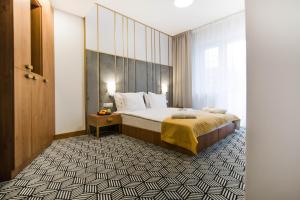 Posteľ alebo postele v izbe v ubytovaní Platinum Residence Boutique