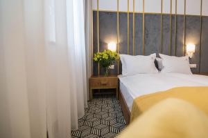 Posteľ alebo postele v izbe v ubytovaní Platinum Residence Boutique