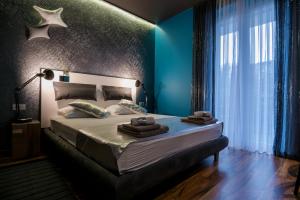 Postel nebo postele na pokoji v ubytování Design B&B Bacvice Arti