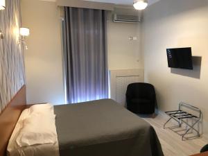 TV a/nebo společenská místnost v ubytování Hotel Frejus