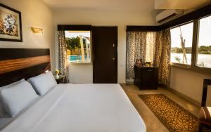 Voodi või voodid majutusasutuse Obelisk Nile Hotel Aswan toas