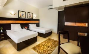 Voodi või voodid majutusasutuse Obelisk Nile Hotel Aswan toas