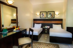 Voodi või voodid majutusasutuse Obelisk Nile Hotel Aswan toas