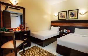 Voodi või voodid majutusasutuse Obelisk Nile Hotel Aswan toas