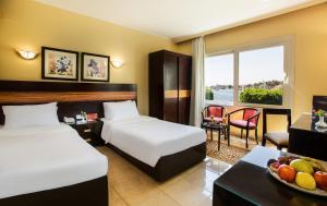 Voodi või voodid majutusasutuse Obelisk Nile Hotel Aswan toas