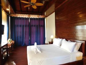 Postel nebo postele na pokoji v ubytování Sengahloune Resort