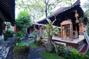 a house with a garden in front of it at Jiwa's House in Ubud