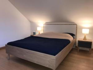 Postel nebo postele na pokoji v ubytování Appartement pieds dans l'eau