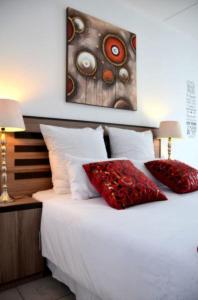 מיטה או מיטות בחדר ב-Azrielle Guesthouse