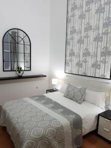 a bedroom with a bed and a large window at Eva's Dream in Las Palmas de Gran Canaria